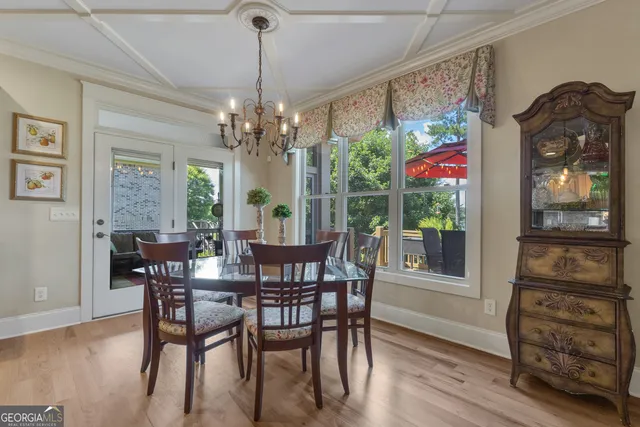 a spacious bathroom with a granite countertop sink a mirror and a shower