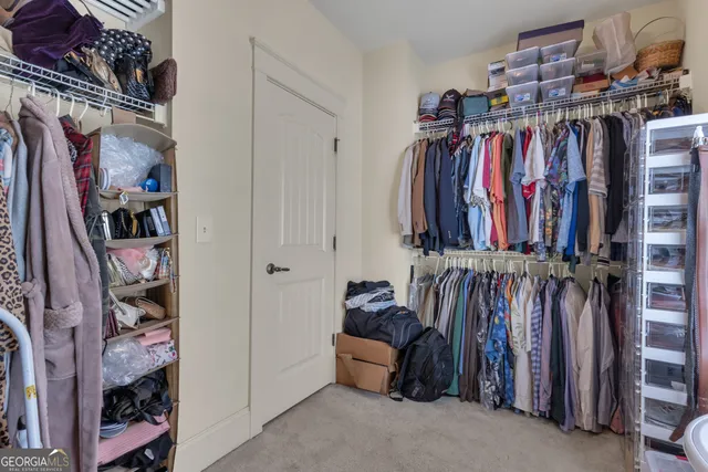 a view of an empty room with windows