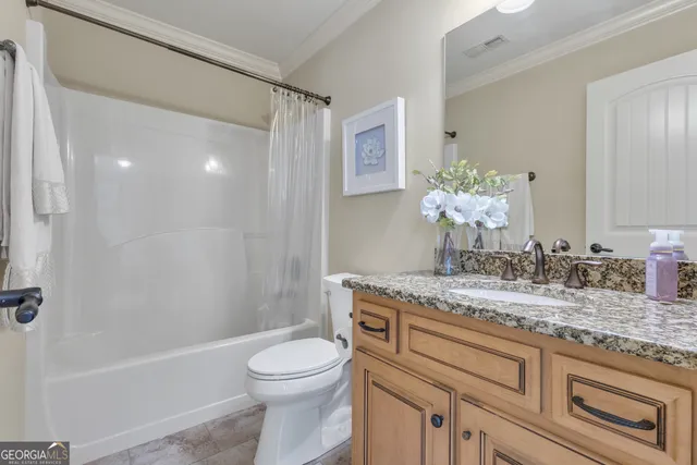 an aerial view of a house with a lake view