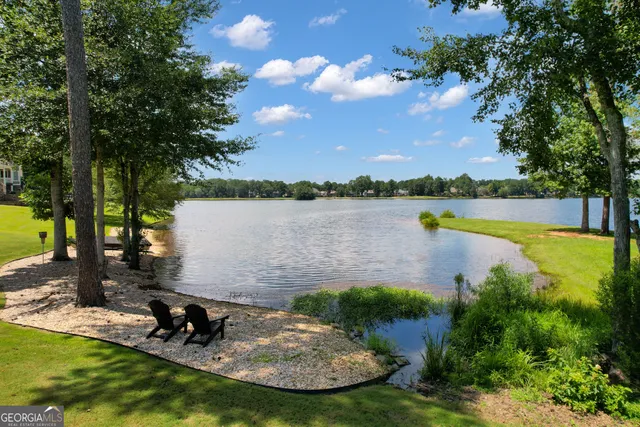 a bathroom with a toilet a sink and a mirror