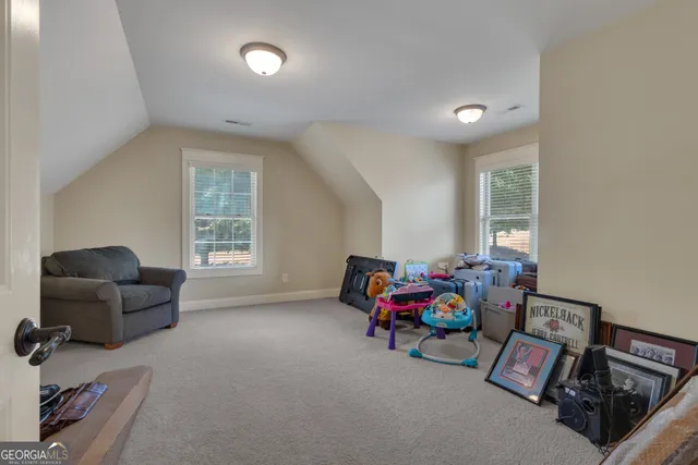 a swimming pool with outdoor seating and yard