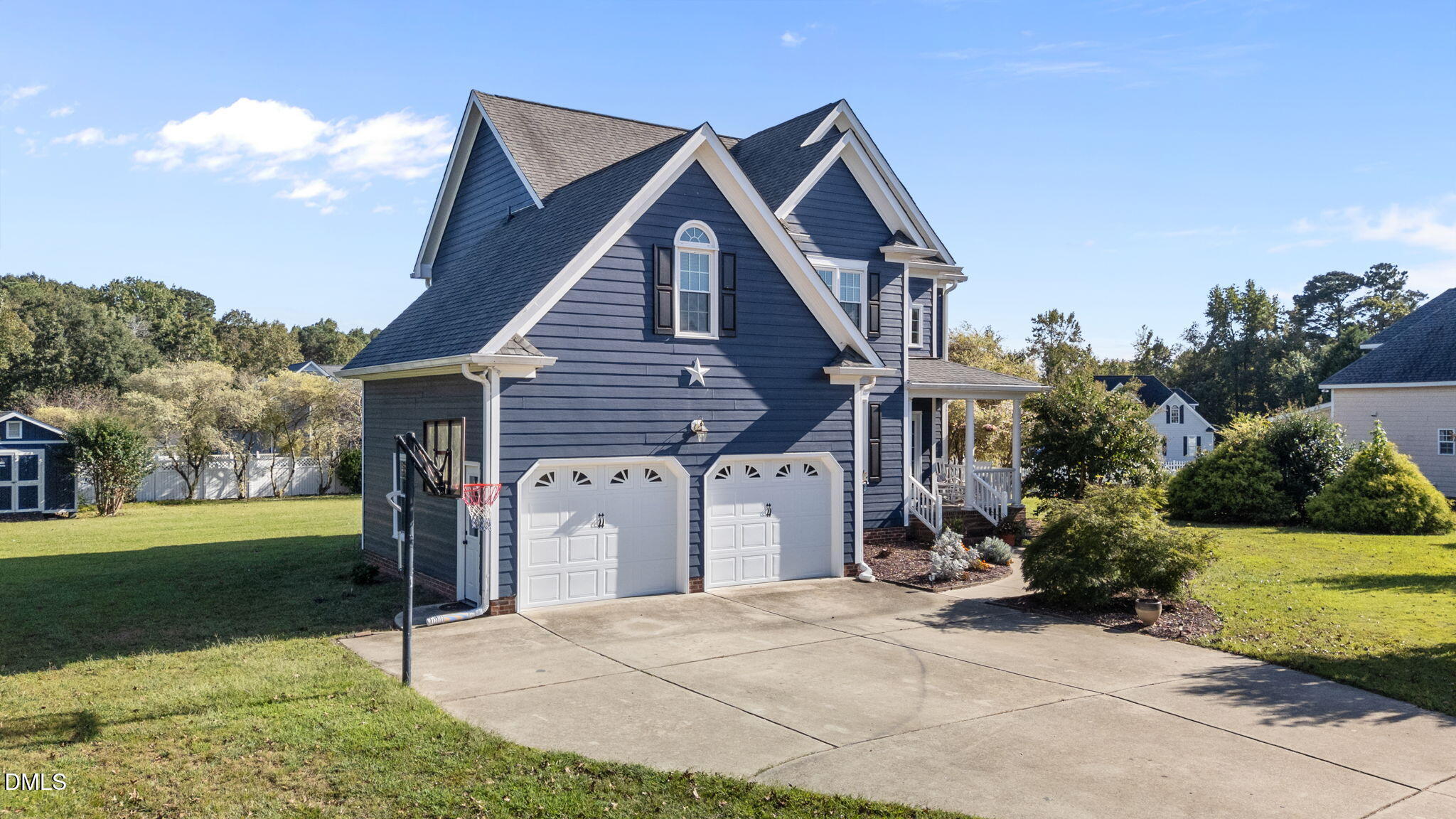 1617 Kendall Hill Road Willow Spring, NC 27592 - Photo 2 of 58 a front view of a house with a yard