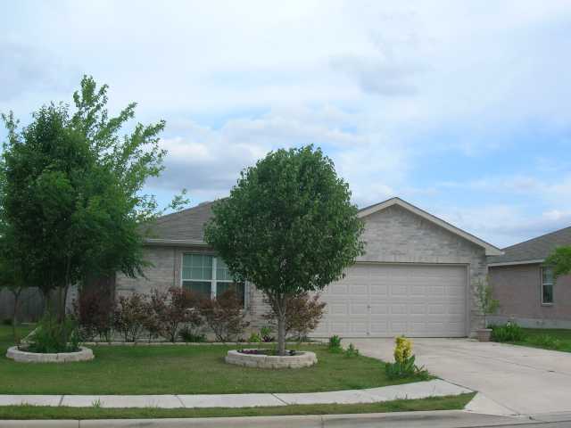 708 Los Robles Road Leander, TX 78641 - Photo 1 of 1 a front view of a house with a yard and garage