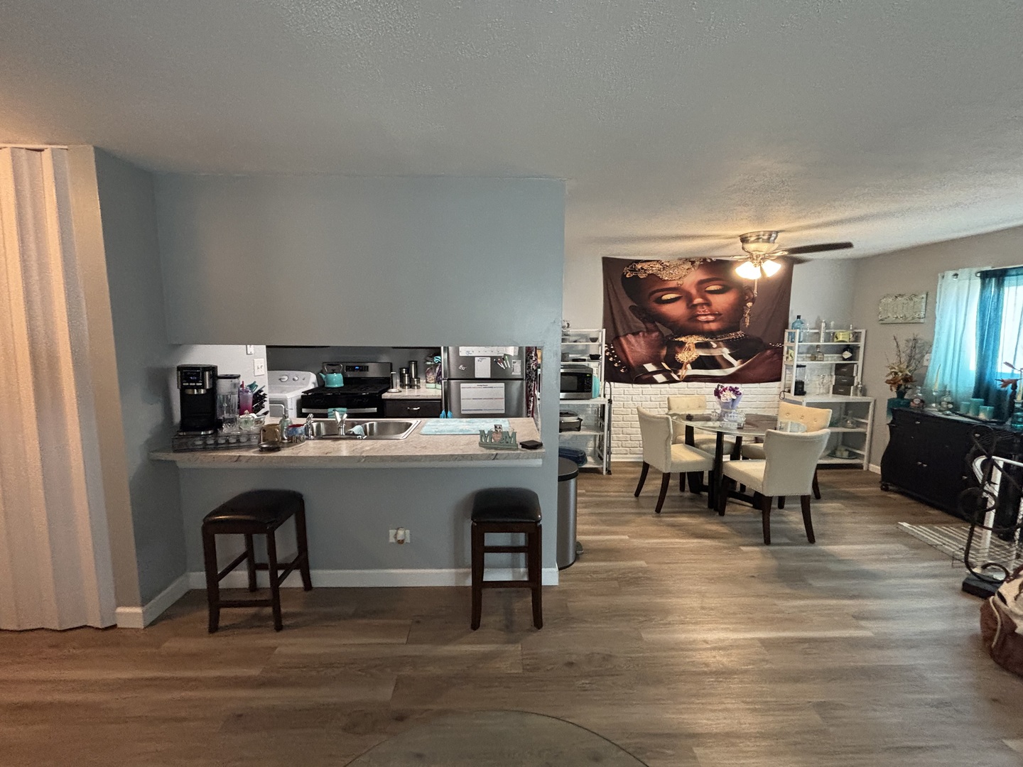 20124 Oak Lane Lynwood, IL 60411 - Photo 7 of 19 a living room with stainless steel appliances kitchen island granite countertop furniture and a fireplace