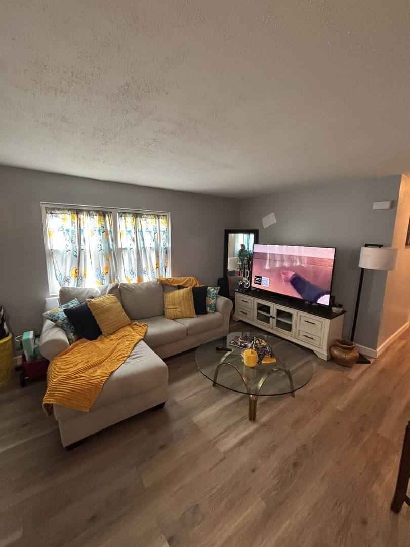 20124 Oak Lane Lynwood, IL 60411 - Photo 10 of 19 a living room with furniture and a wooden floor
