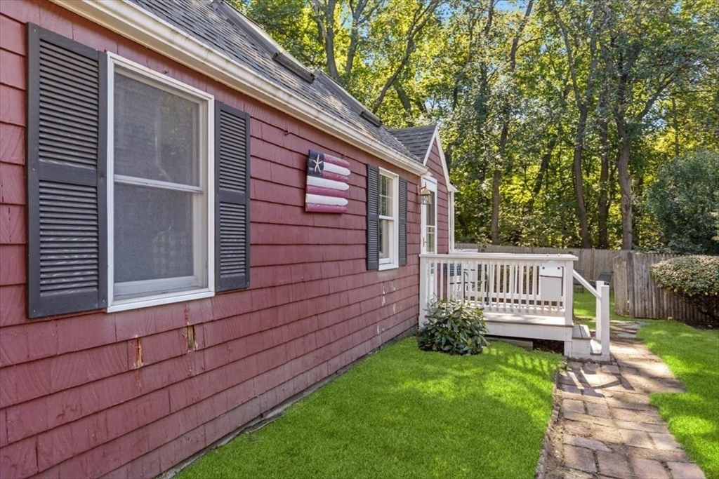 11 Sanborn Road Hingham, MA 02043 - Photo 24 of 33 a view of a house with a wooden fence and a backyard