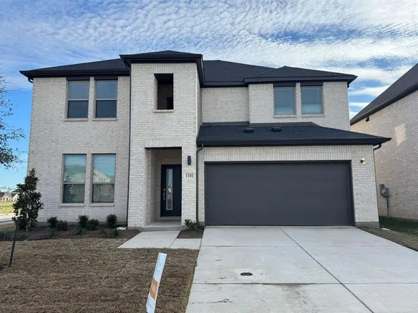 a front view of a house with yard