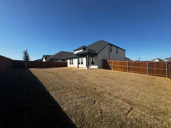 a house view with a garden space