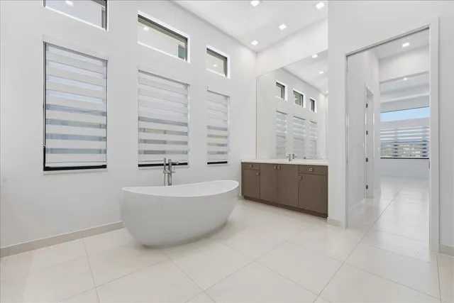 a bathroom with a bathtub and shower