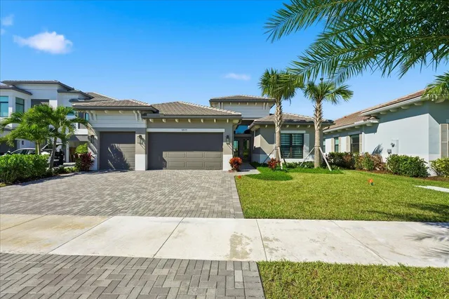 a front view of house with a garden