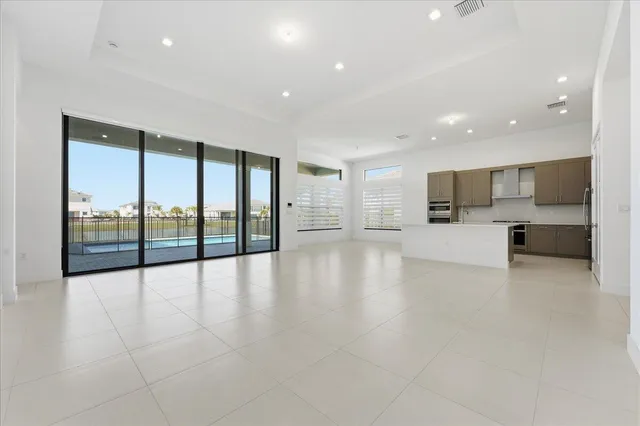a view of a kitchen with a sink and a stove top oven