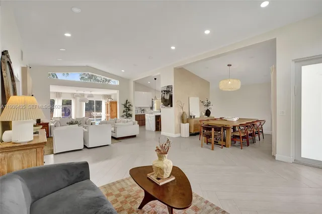 a kitchen with stainless steel appliances kitchen island granite countertop a sink and cabinets