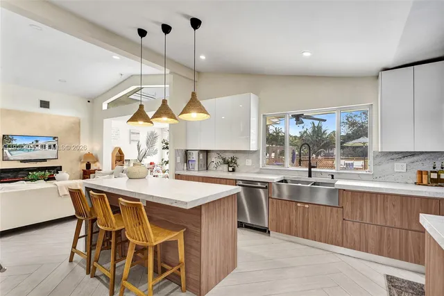 a view of a house with backyard and swimming pool