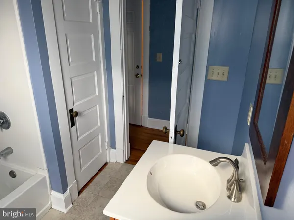 a bathroom with a sink and a tub