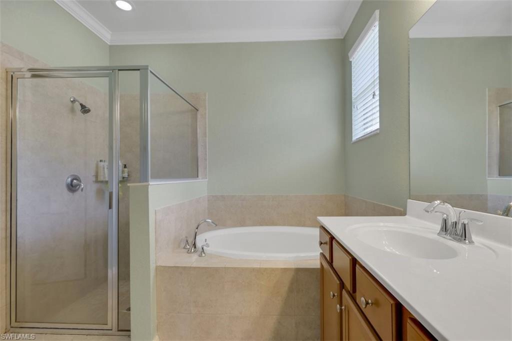 2391 Heydon Circle East Naples, FL 34120 - Photo 22 of 42 a bathroom with a sink a toilet and shower