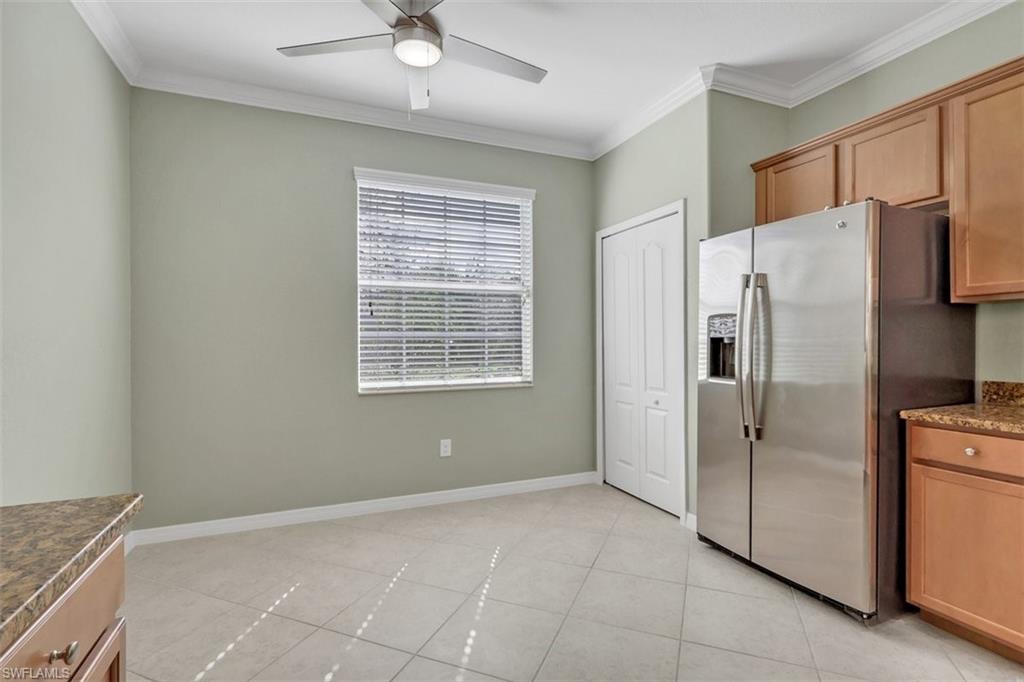 2391 Heydon Circle East Naples, FL 34120 - Photo 10 of 42 a kitchen with a refrigerator and window