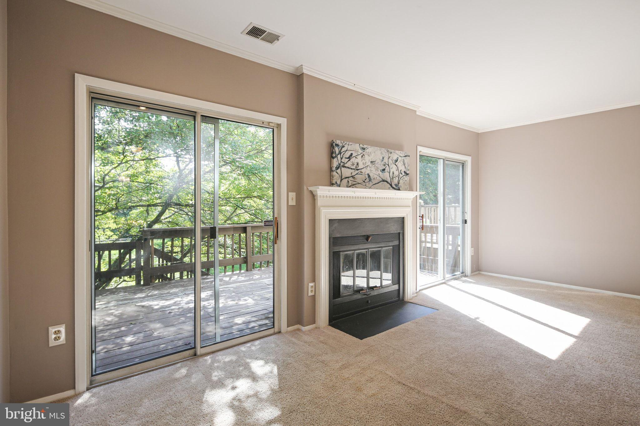 8205 Tall Trees Court Ellicott City, MD 21043 - Photo 11 of 37 Bright and airy living space with nature views.