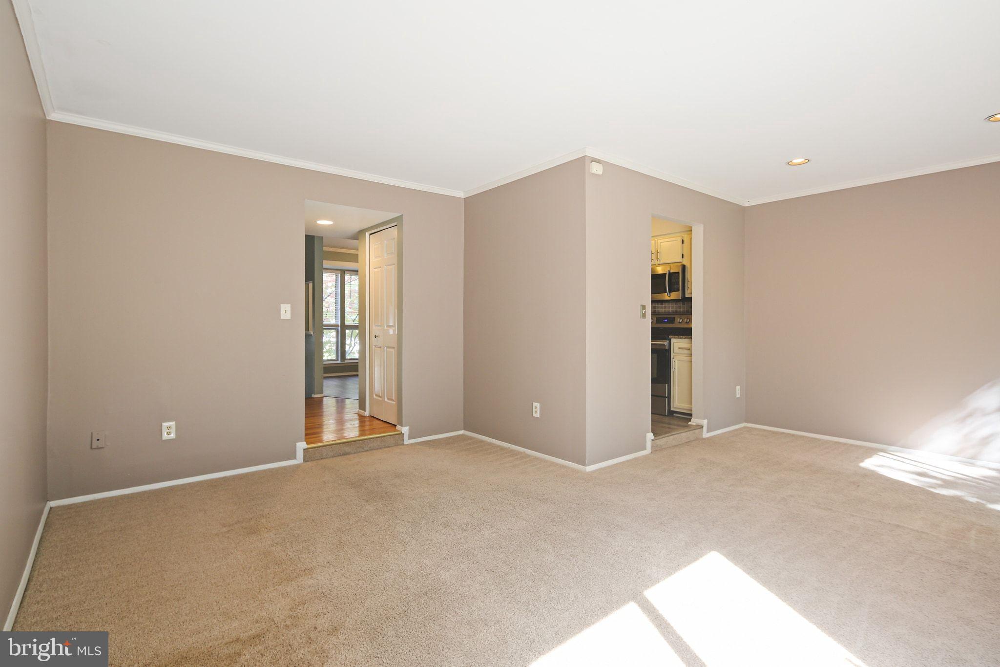 8205 Tall Trees Court Ellicott City, MD 21043 - Photo 13 of 37 Spacious, sunlit living area awaits your touch.