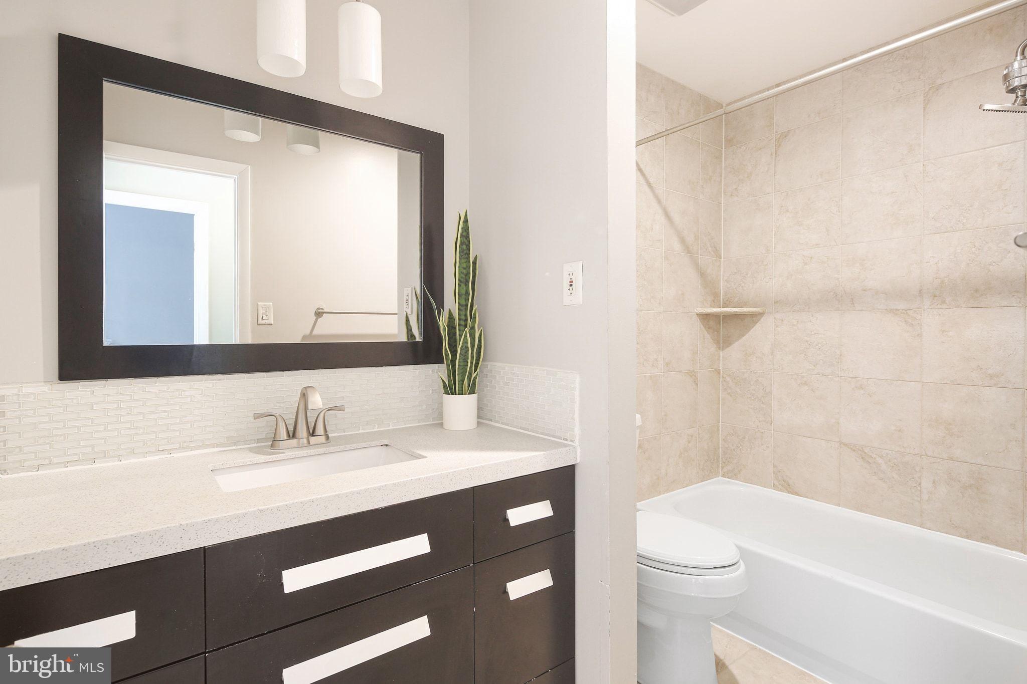 8205 Tall Trees Court Ellicott City, MD 21043 - Photo 21 of 37 Modern bathroom with sleek finishes.