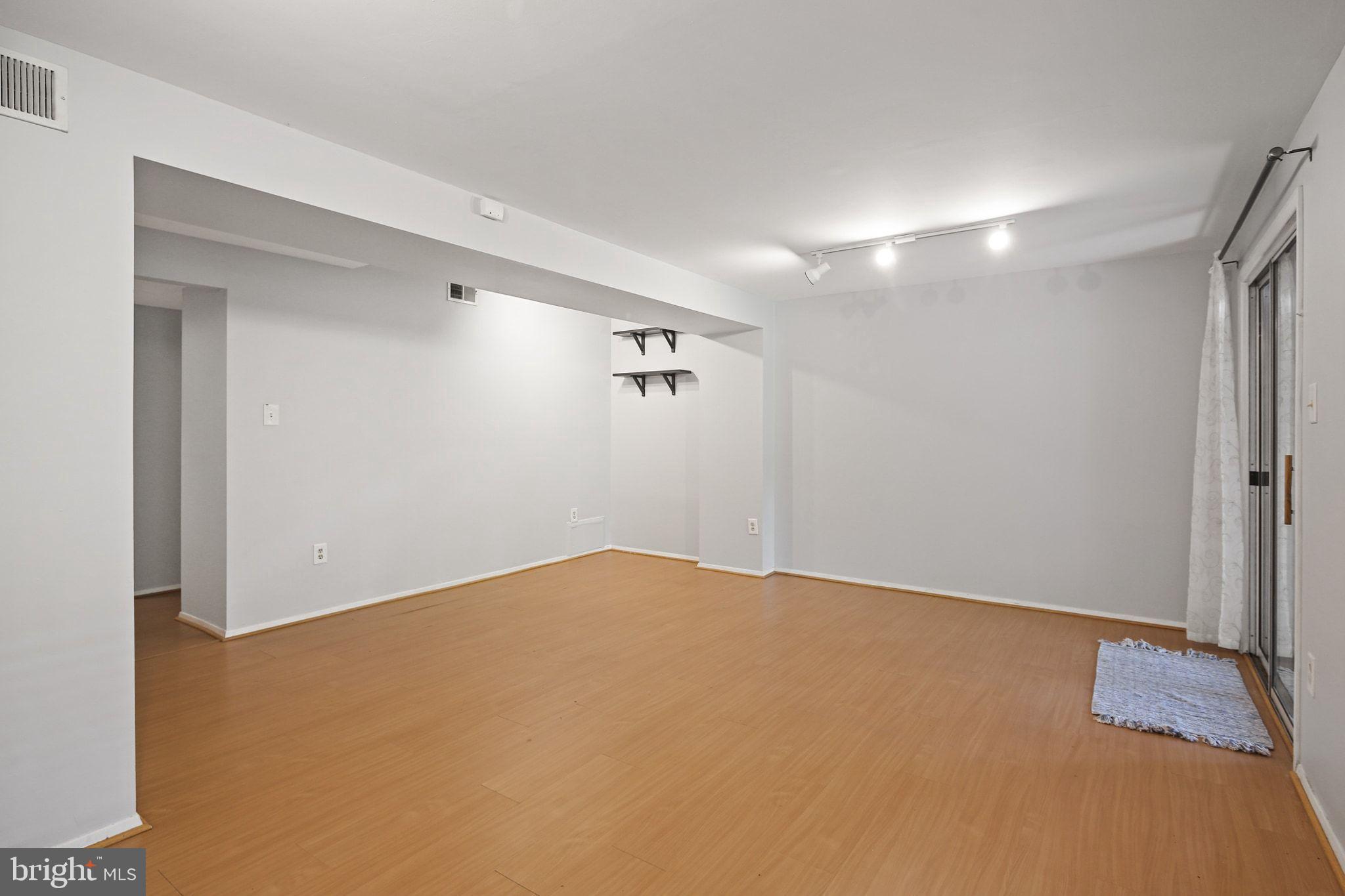 8205 Tall Trees Court Ellicott City, MD 21043 - Photo 32 of 37 Spacious, versatile living area awaits creativity.