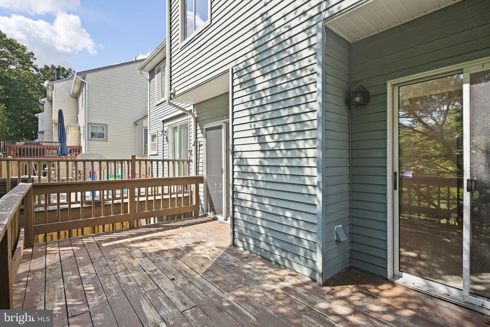 8205 Tall Trees Court Ellicott City, MD 21043 - Photo 33 of 37 Sunny deck with inviting outdoor space.