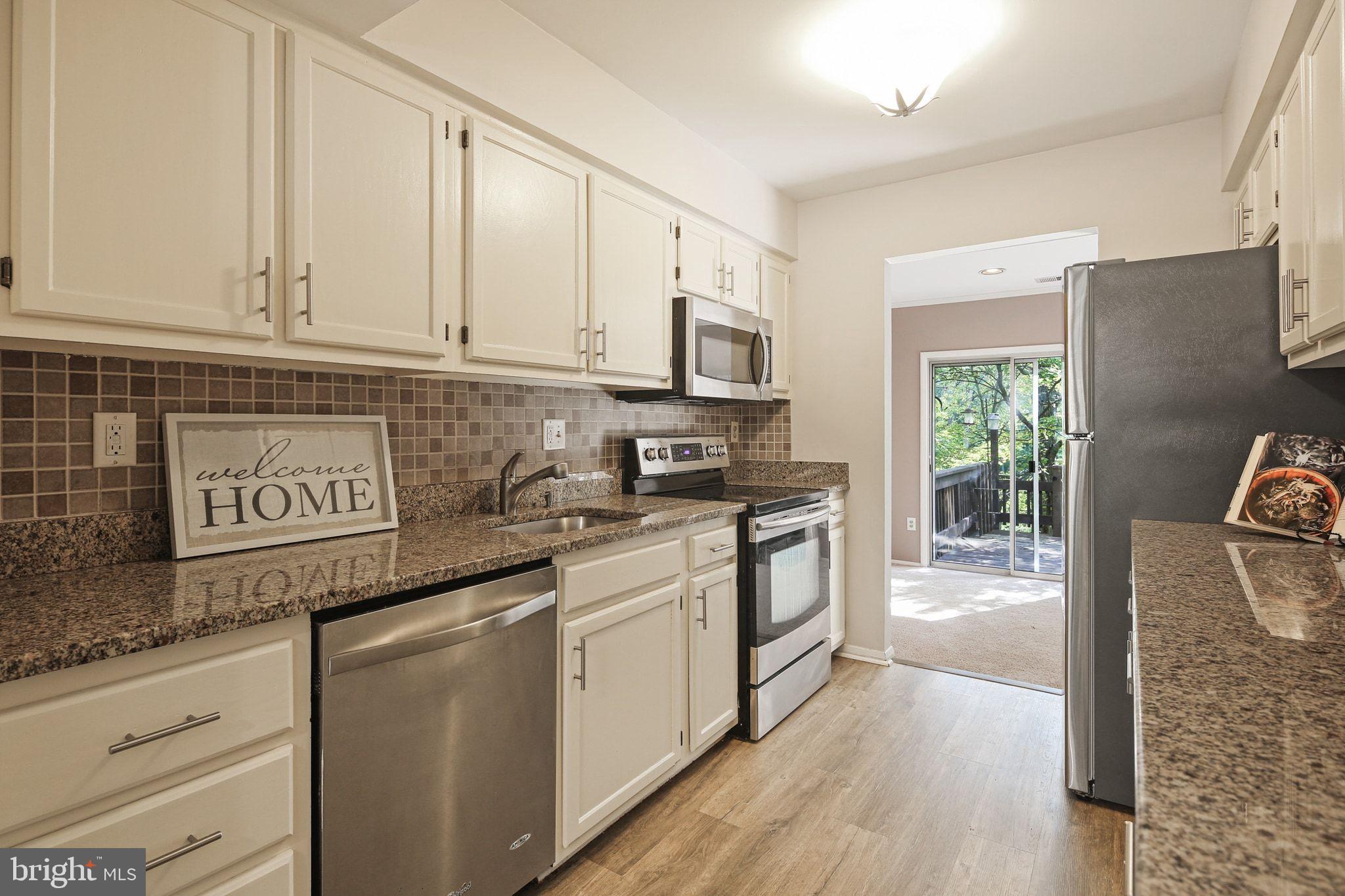 8205 Tall Trees Court Ellicott City, MD 21043 - Photo 8 of 37 Modern kitchen with inviting natural light.