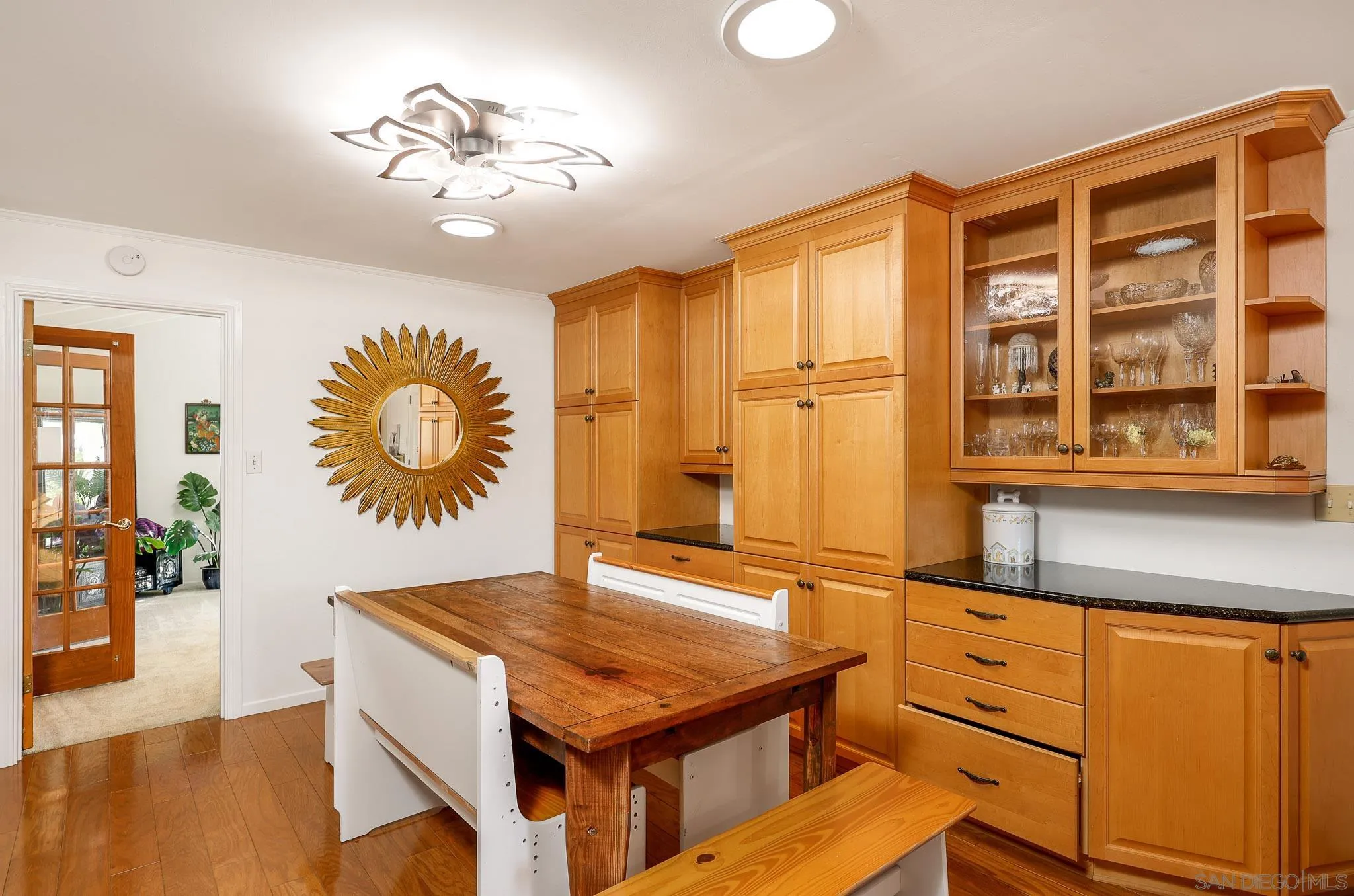 1553 Ranchwood Lane Fallbrook, CA 92028 - Photo 13 of 60 a room with chandelier and wooden floor