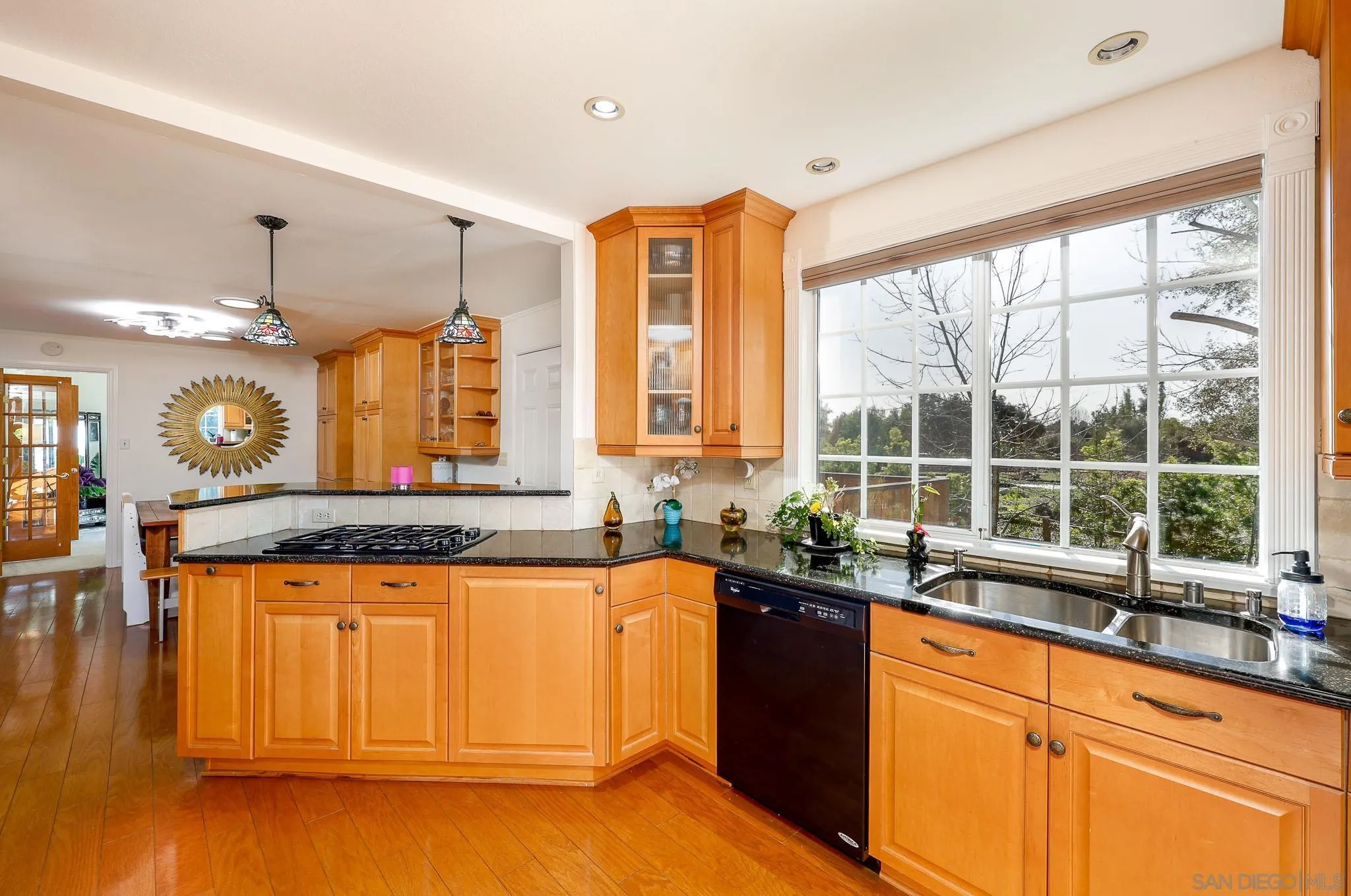 1553 Ranchwood Lane Fallbrook, CA 92028 - Photo 15 of 60 a view of a kitchen with a sink and large window
