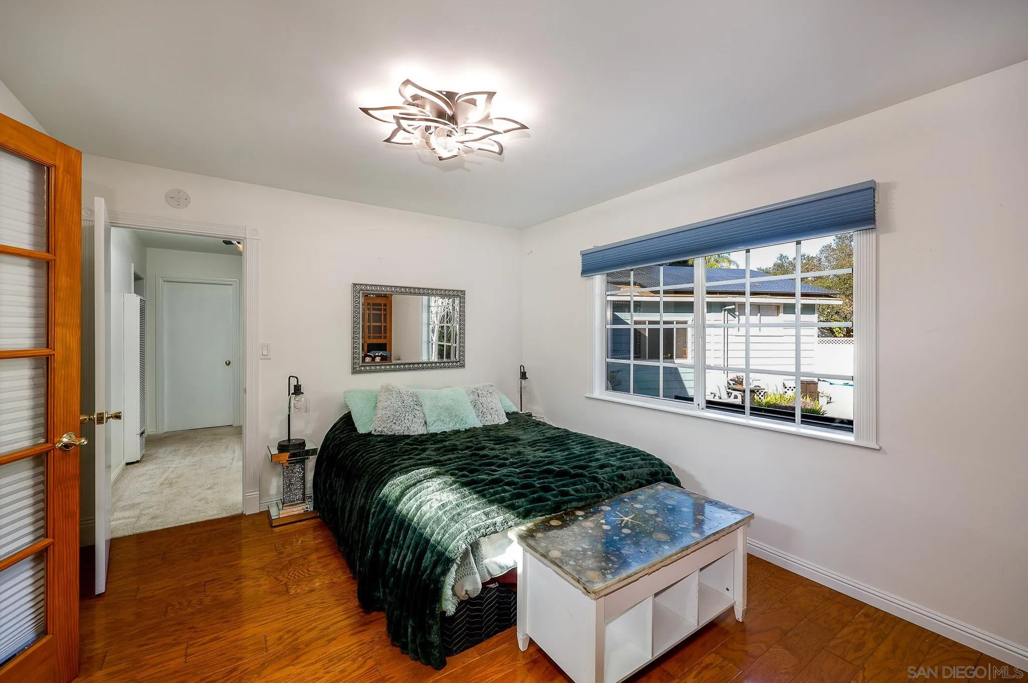 1553 Ranchwood Lane Fallbrook, CA 92028 - Photo 23 of 60 a bedroom with a bed and a window with outer view