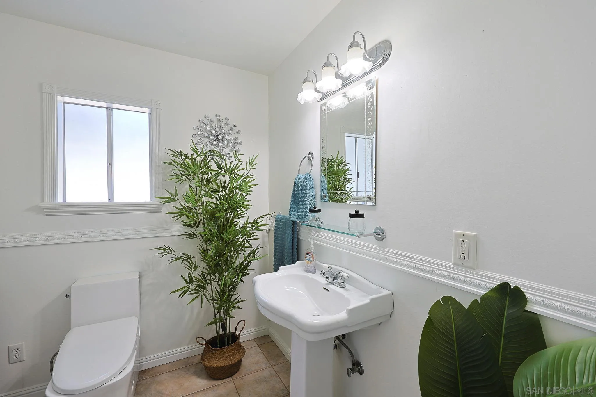 1553 Ranchwood Lane Fallbrook, CA 92028 - Photo 28 of 60 a bathroom with a sink toilet and a mirror
