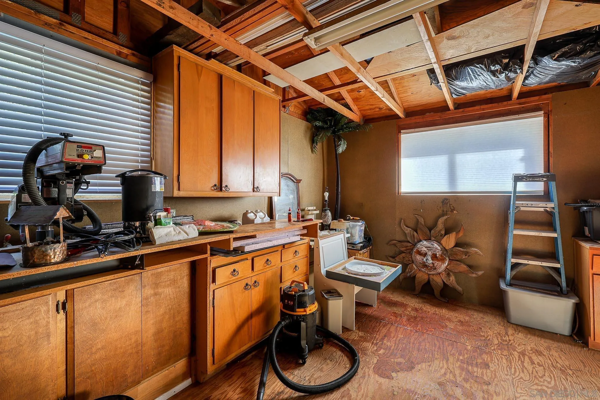 1553 Ranchwood Lane Fallbrook, CA 92028 - Photo 36 of 60 a storage room with furniture and a window