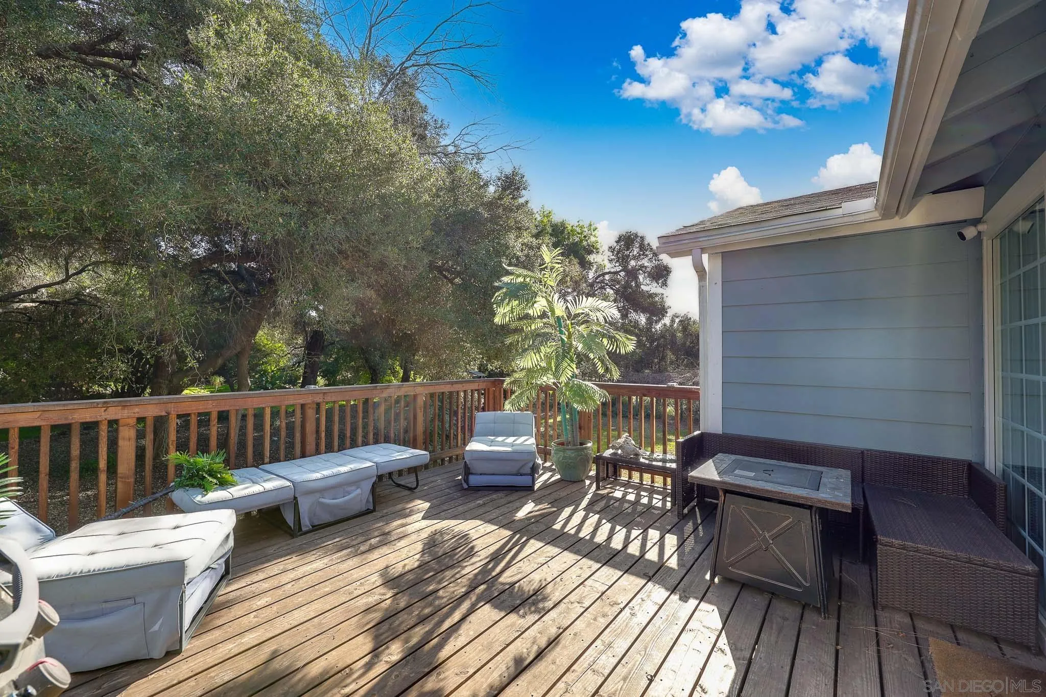 1553 Ranchwood Lane Fallbrook, CA 92028 - Photo 39 of 60 a view of balcony with wooden floor outdoor seating and yard in the back