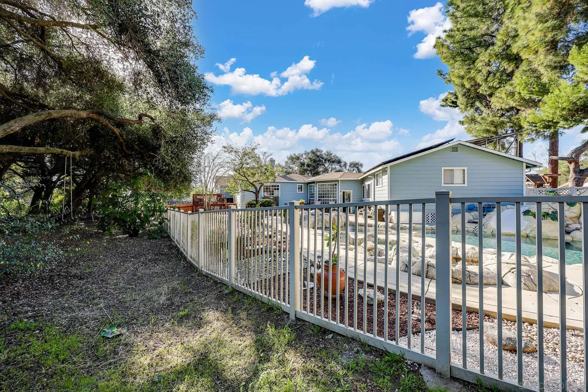 1553 Ranchwood Lane Fallbrook, CA 92028 - Photo 46 of 60 a view of a houses on a balcony