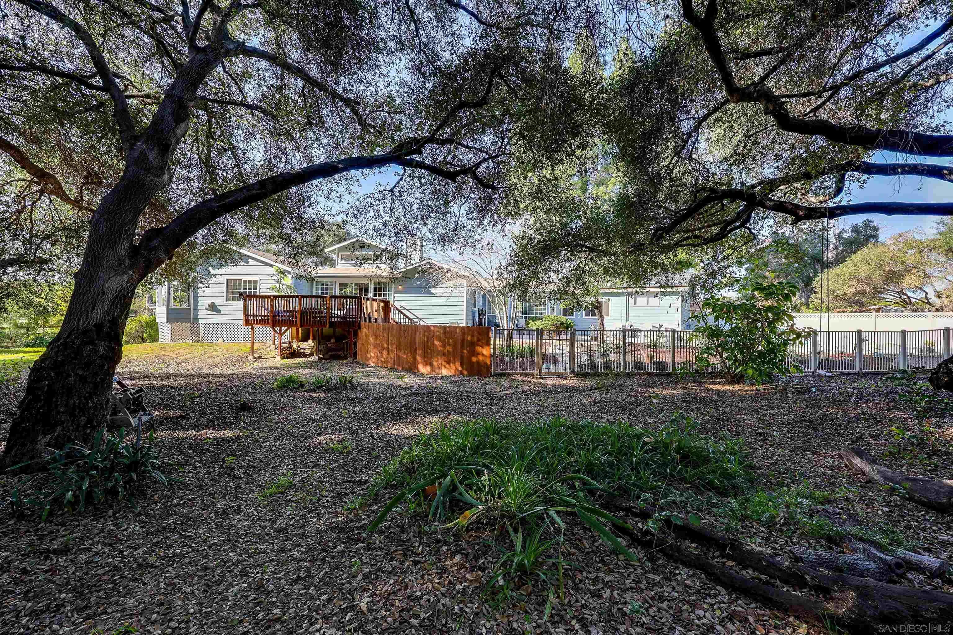 1553 Ranchwood Lane Fallbrook, CA 92028 - Photo 49 of 60 a view of a house with large trees