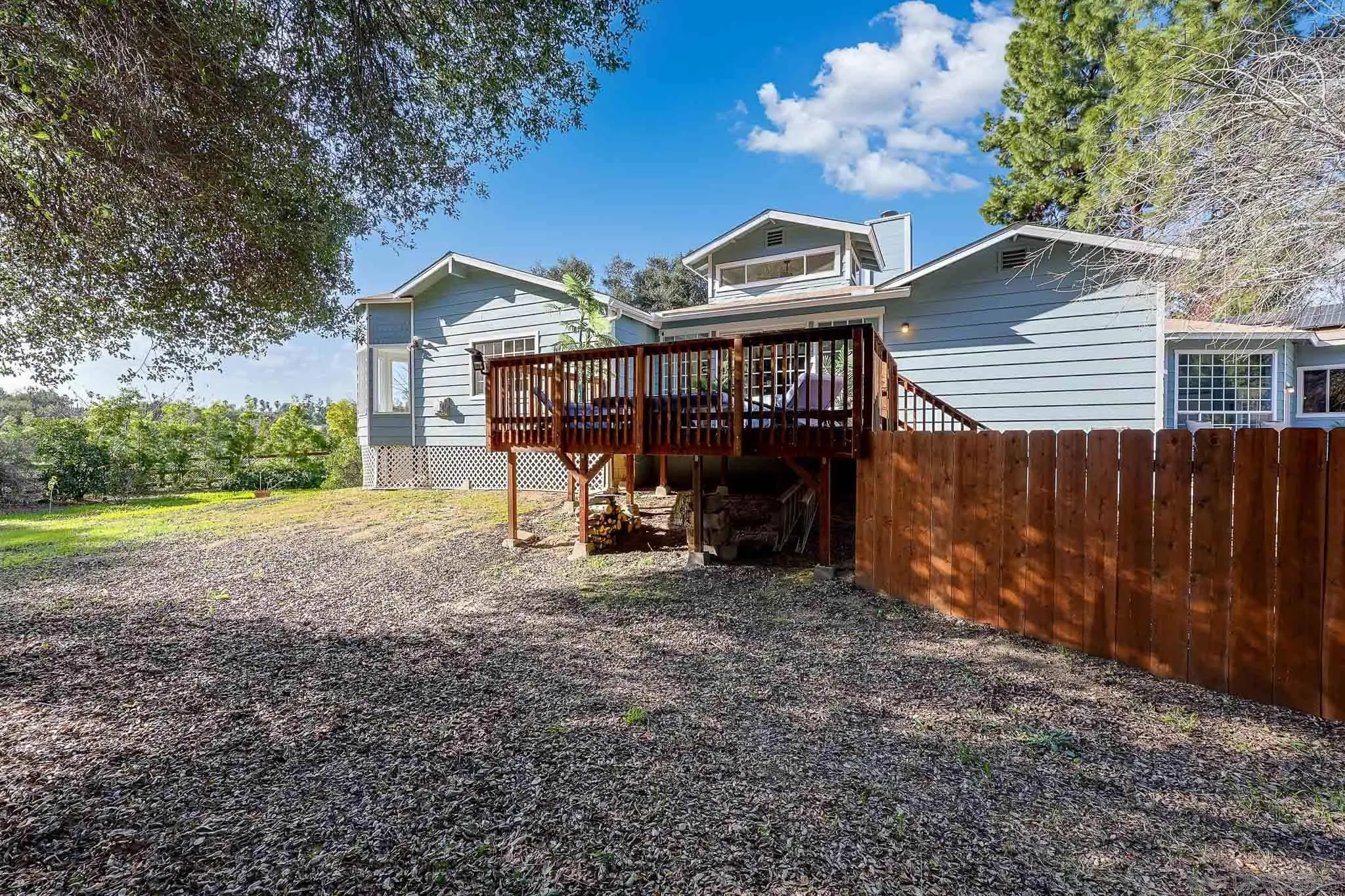 1553 Ranchwood Lane Fallbrook, CA 92028 - Photo 50 of 60 a view of a house with a yard