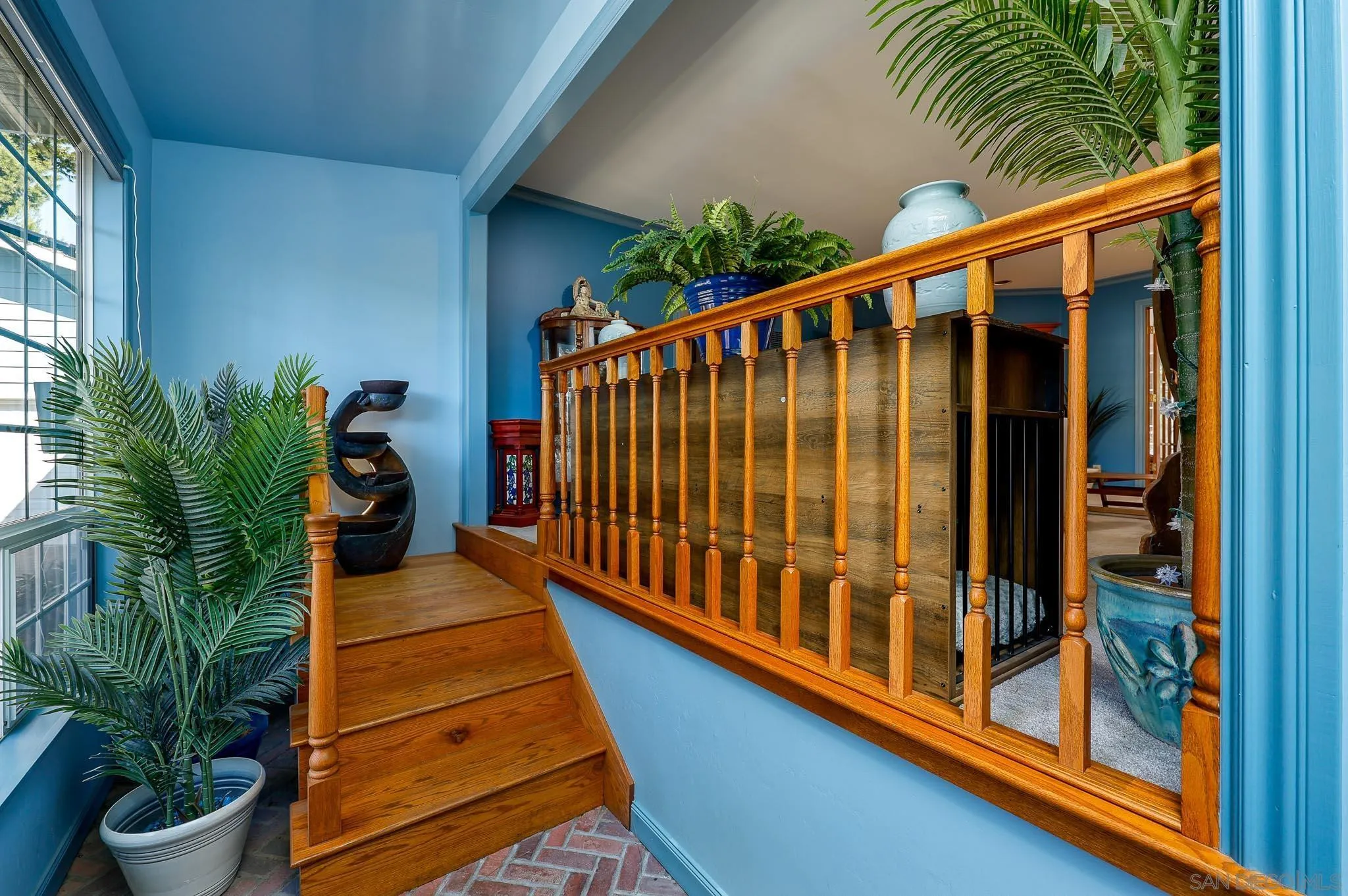 1553 Ranchwood Lane Fallbrook, CA 92028 - Photo 7 of 60 a balcony with table and potted plants