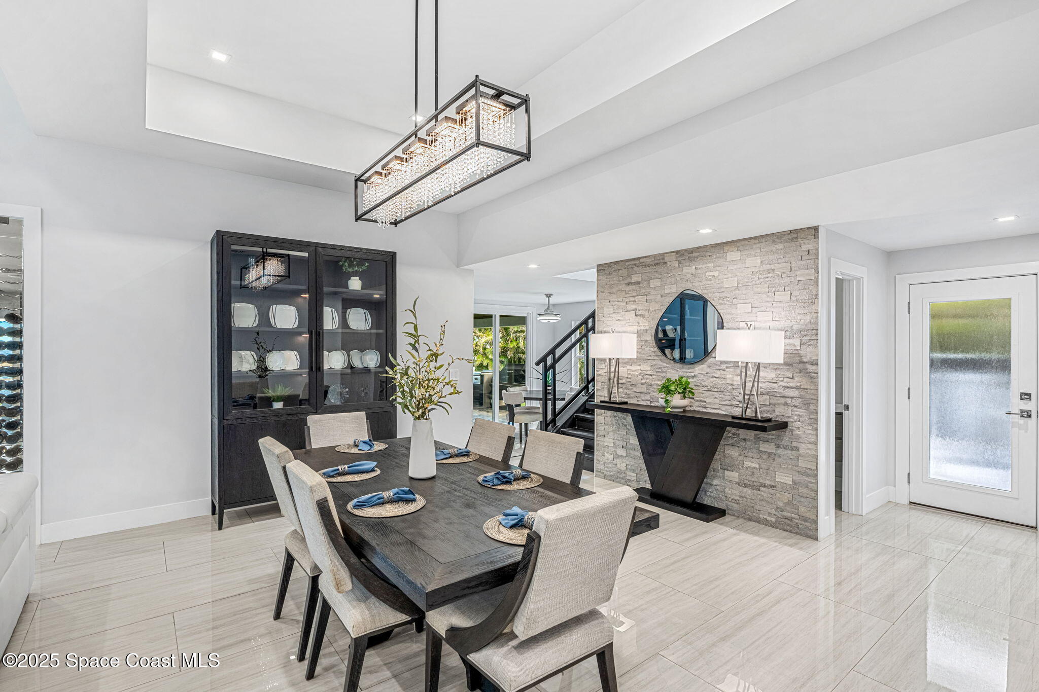 6225 Capstan Court Rockledge, FL 32955 - Photo 11 of 73 a view of a dining room with furniture a chandelier and wooden floor