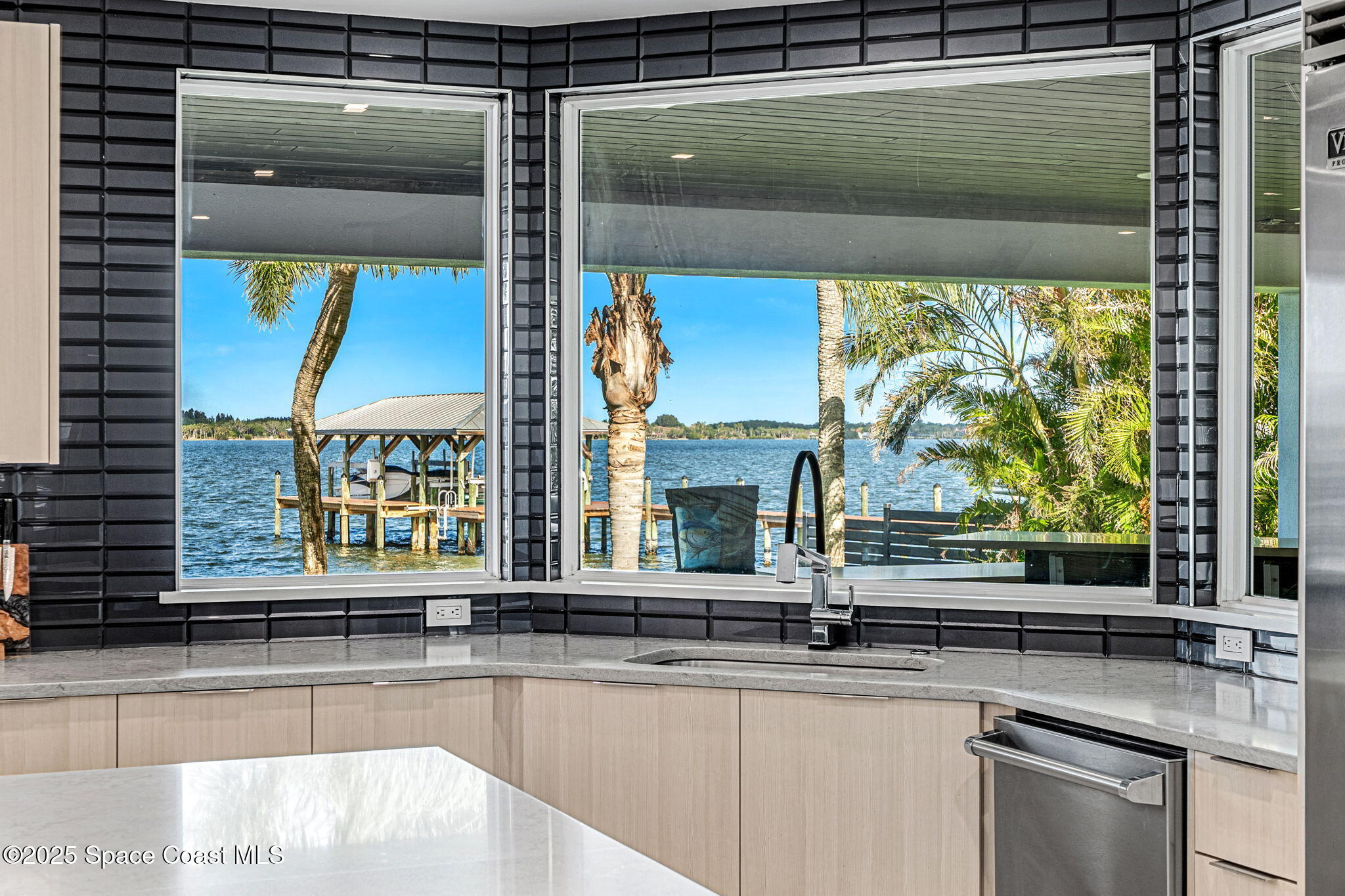 6225 Capstan Court Rockledge, FL 32955 - Photo 15 of 73 a kitchen with a sink and a large window