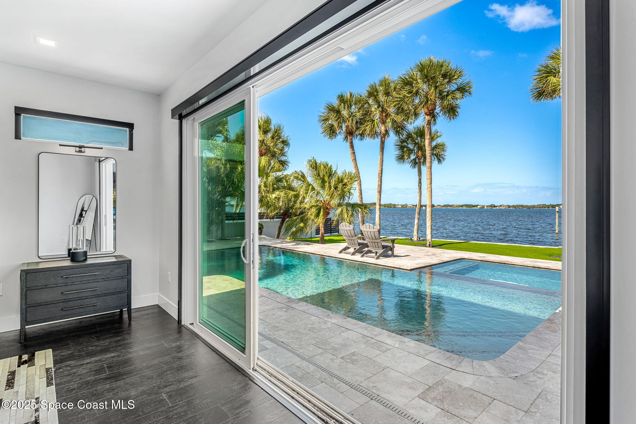 6225 Capstan Court Rockledge, FL 32955 - Photo 21 of 73 a view of a living room and floor to ceiling window and potted plant