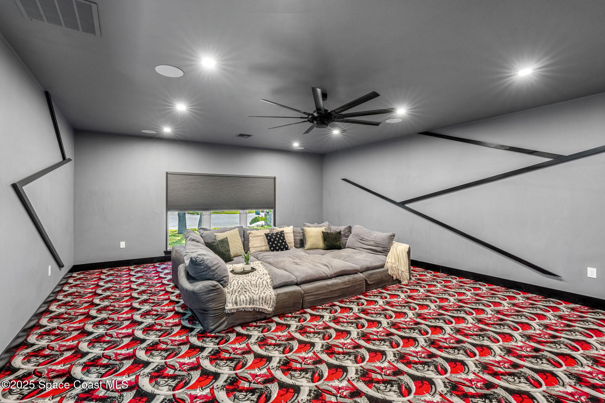 6225 Capstan Court Rockledge, FL 32955 - Photo 26 of 73 a living room with a couch and a chandelier