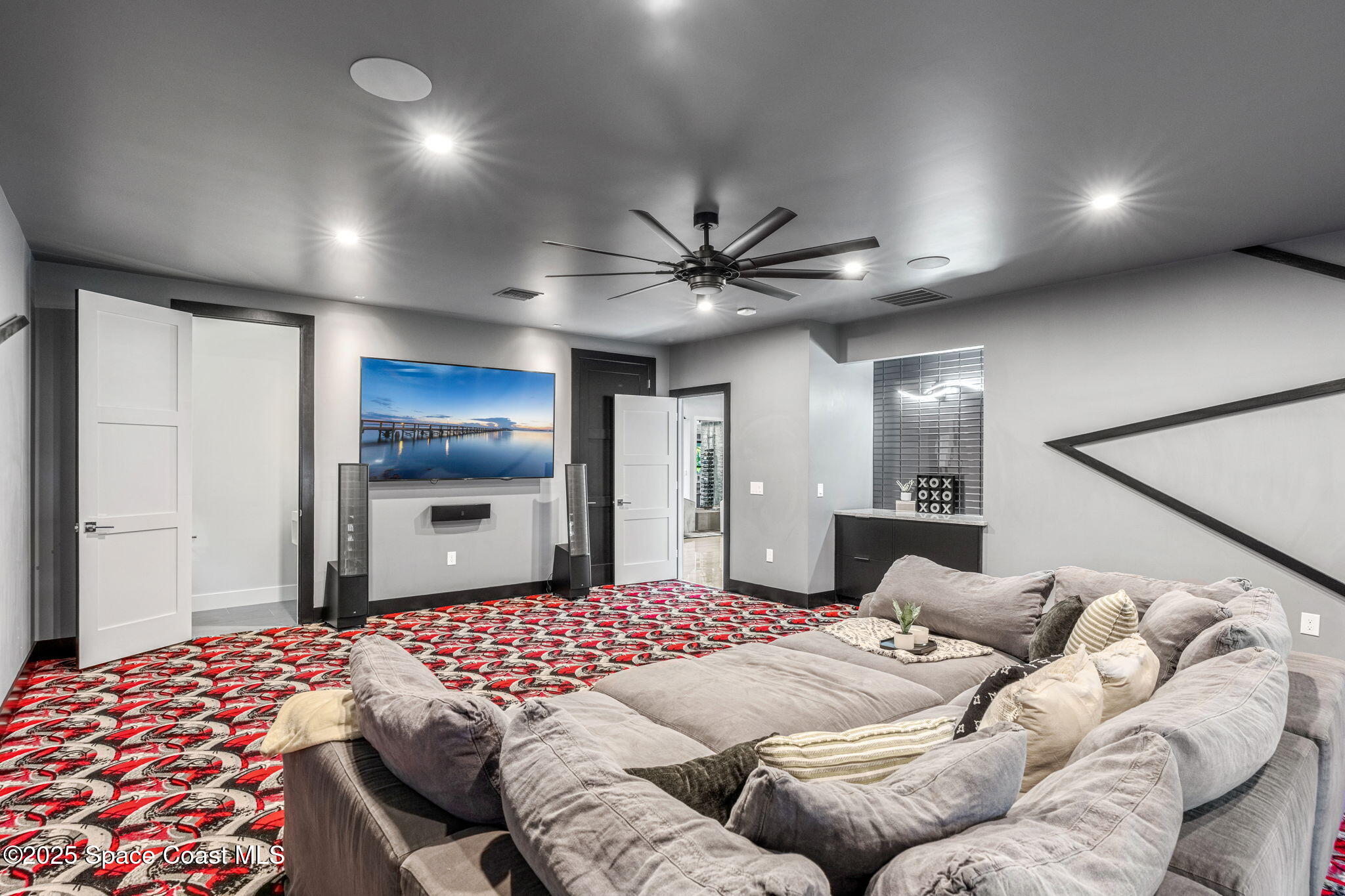 6225 Capstan Court Rockledge, FL 32955 - Photo 27 of 73 a bedroom with a large bed and a chandelier