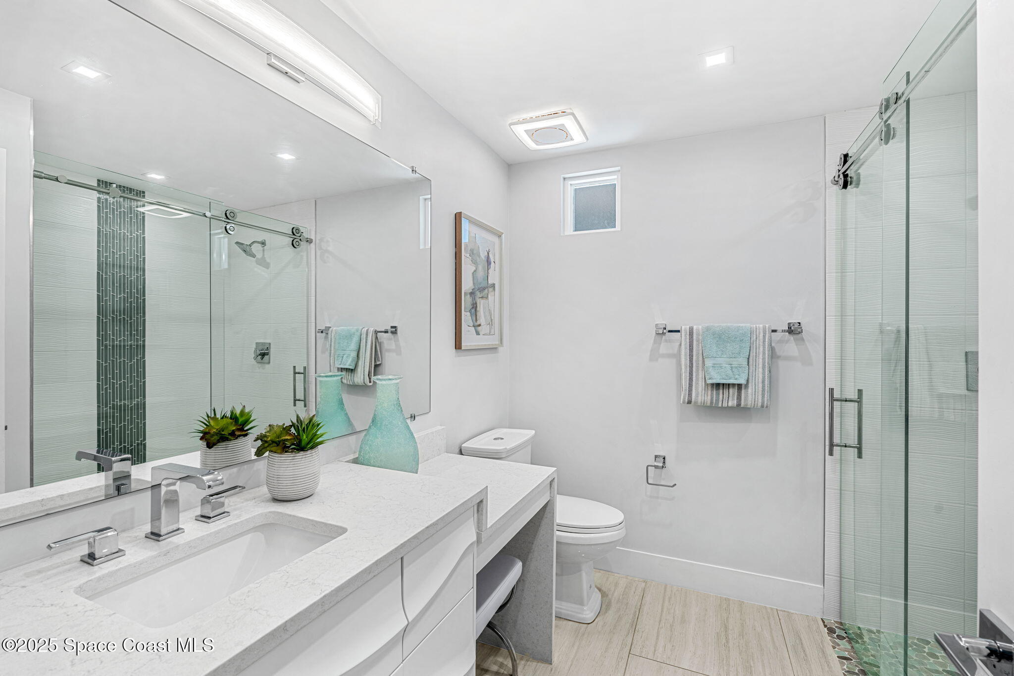 6225 Capstan Court Rockledge, FL 32955 - Photo 29 of 73 a bathroom with a sink a toilet and shower