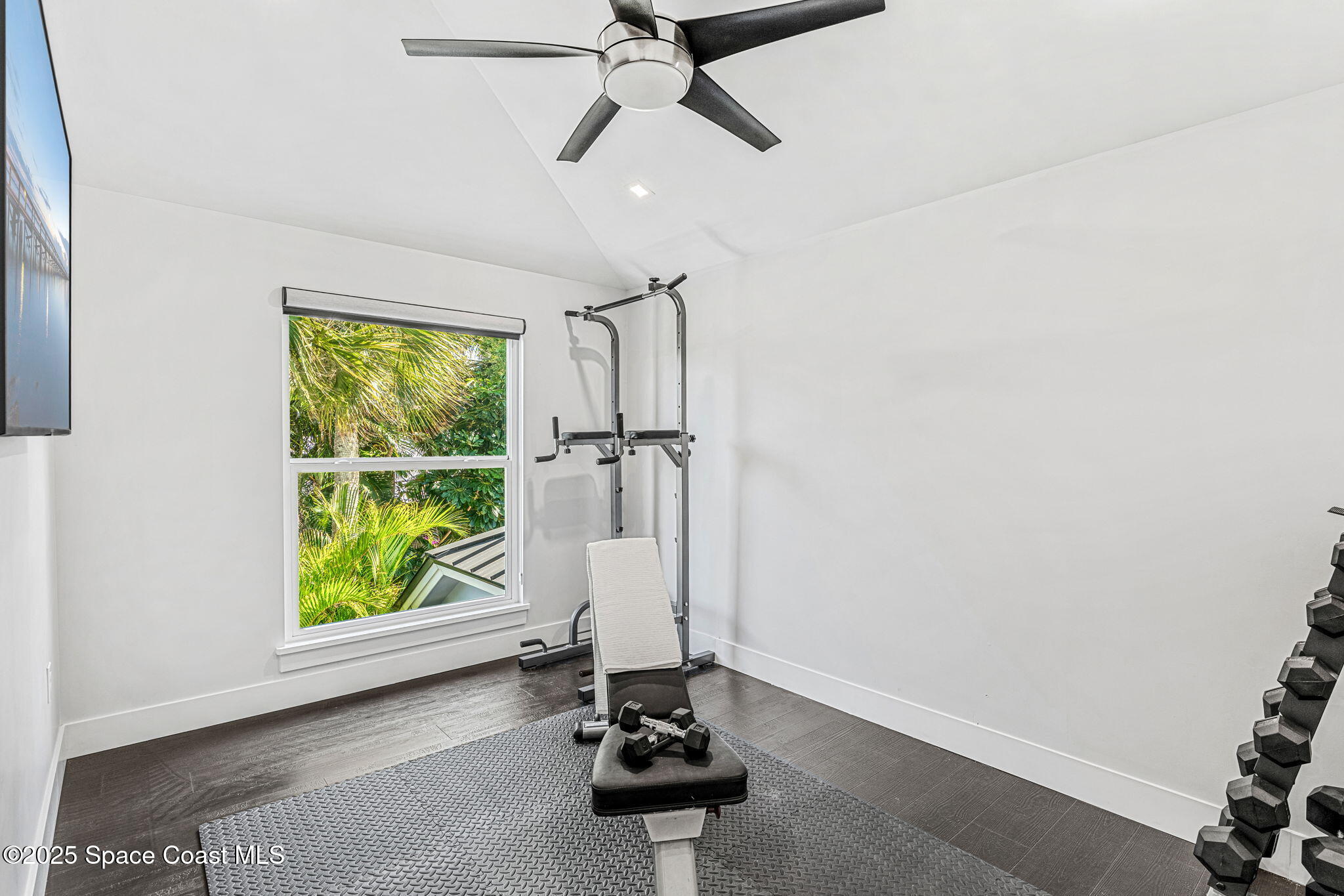 6225 Capstan Court Rockledge, FL 32955 - Photo 36 of 73 a view of a room with gym equipment and a large window