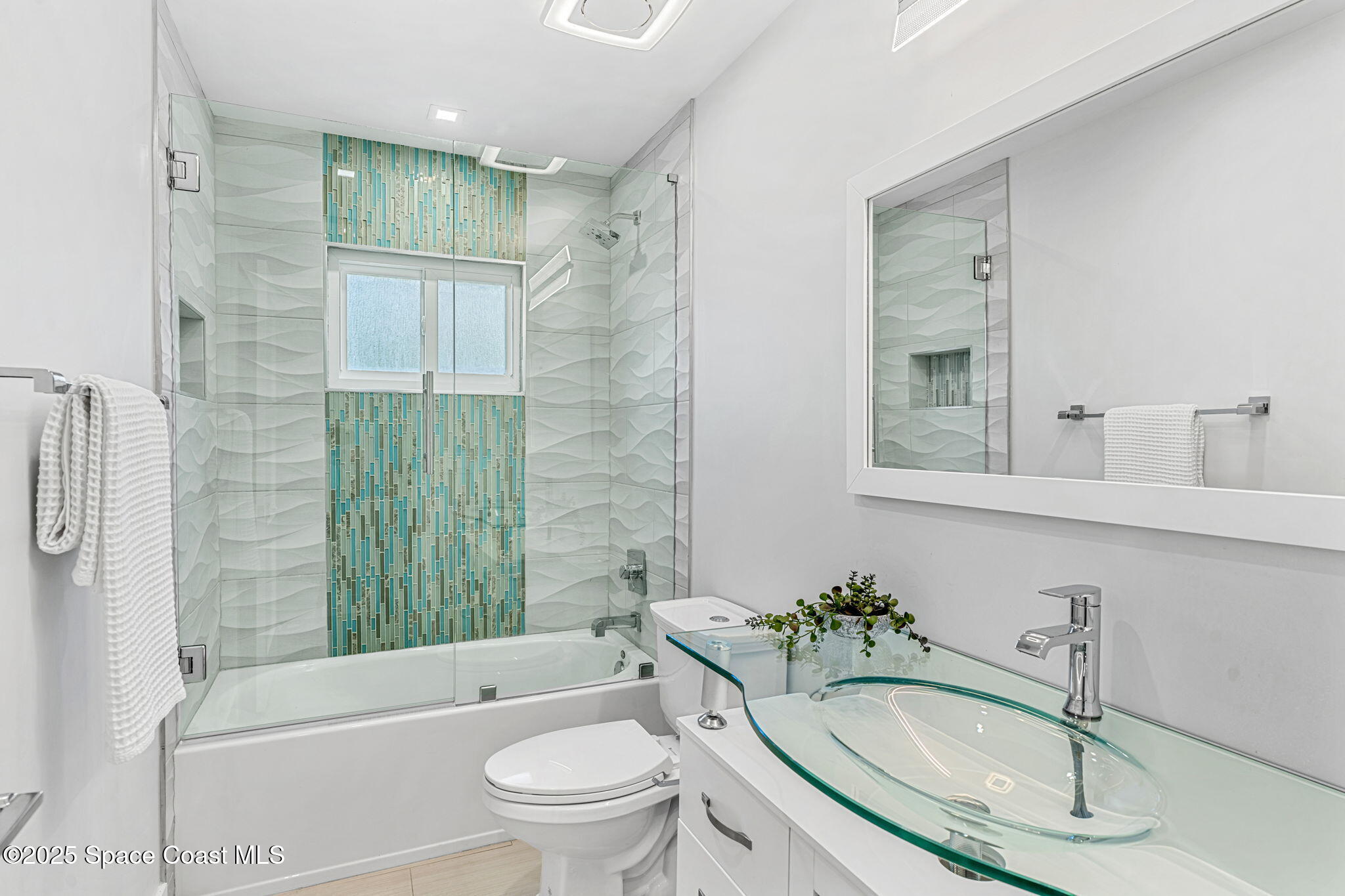 6225 Capstan Court Rockledge, FL 32955 - Photo 37 of 73 a bathroom with a sink toilet a shower and bathtub