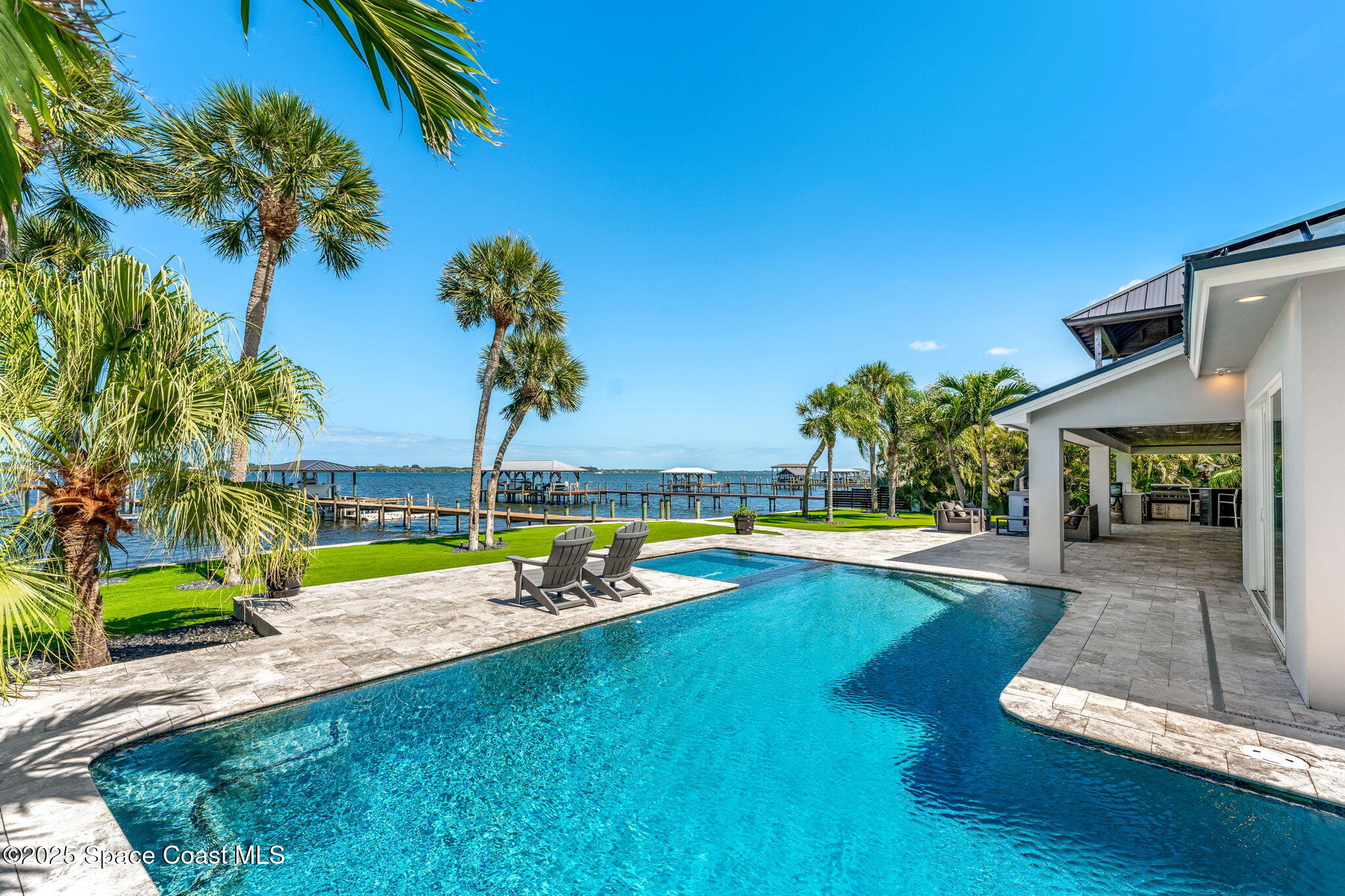 6225 Capstan Court Rockledge, FL 32955 - Photo 42 of 73 a view of a house with swimming pool and a yard