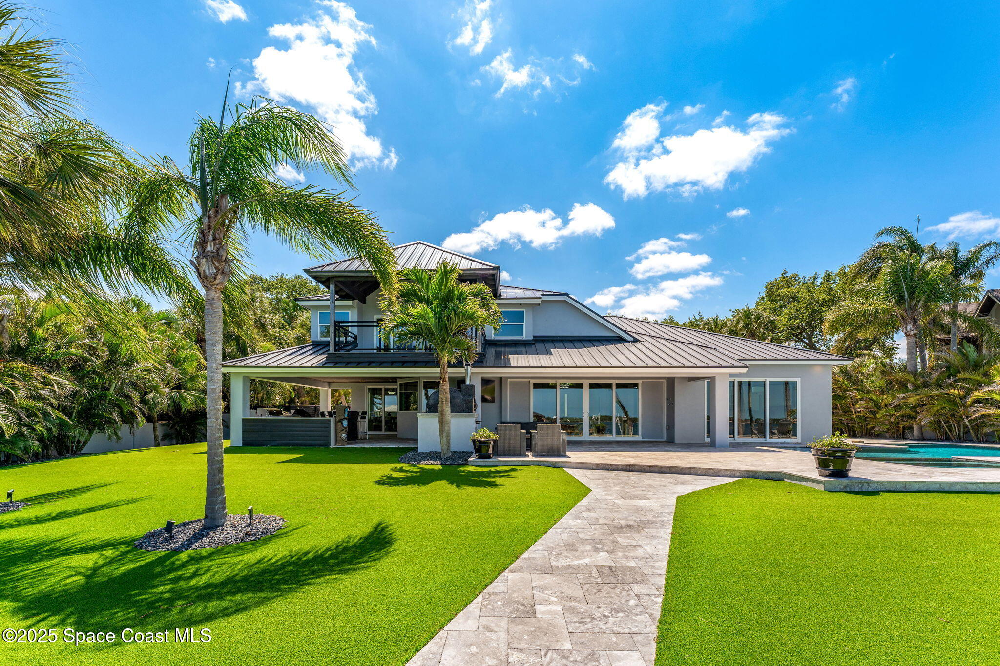6225 Capstan Court Rockledge, FL 32955 - Photo 48 of 73 a view of a house with swimming pool and porch with furniture