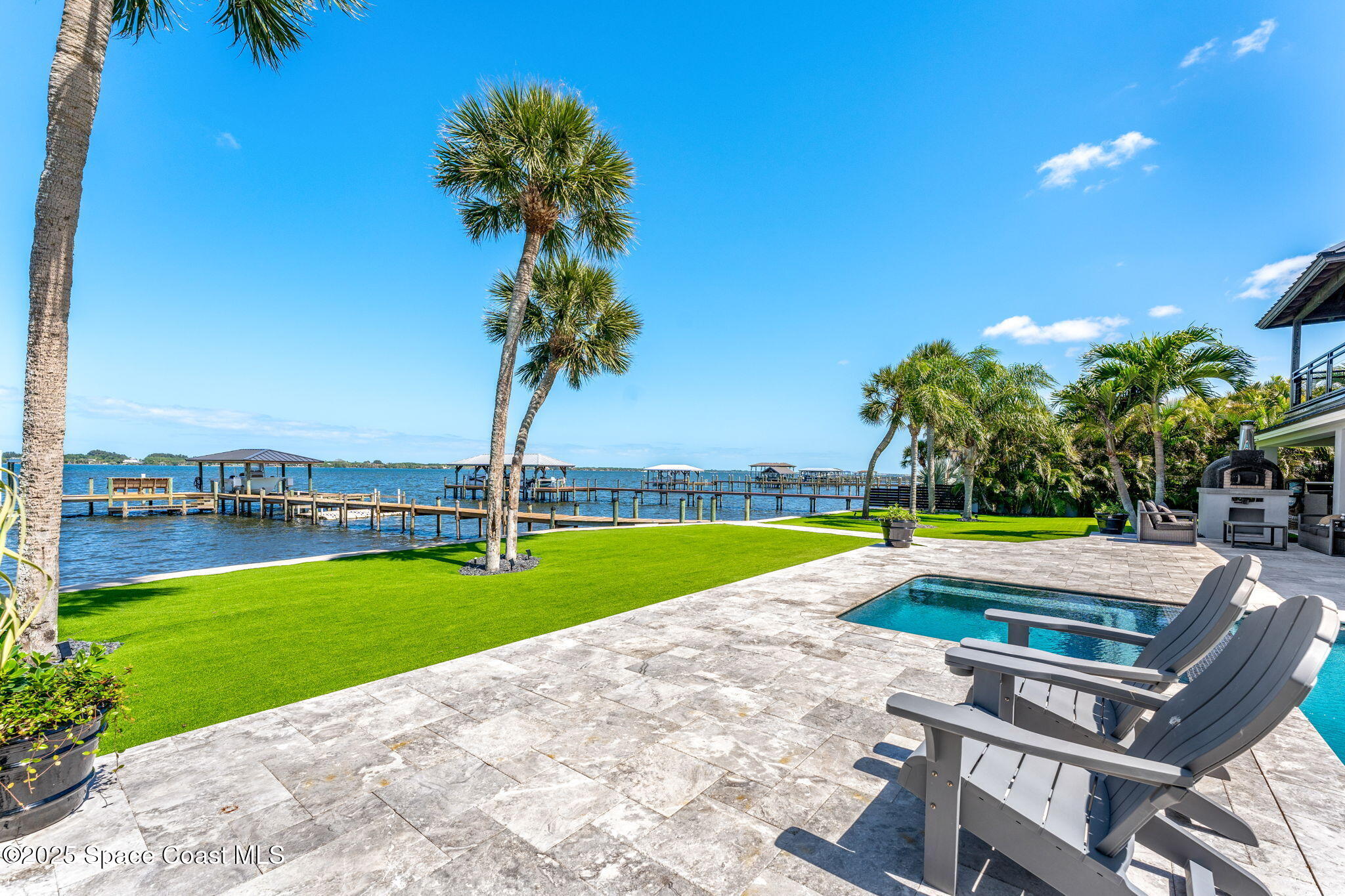 6225 Capstan Court Rockledge, FL 32955 - Photo 51 of 73 a view of a swimming pool and lounge chairs
