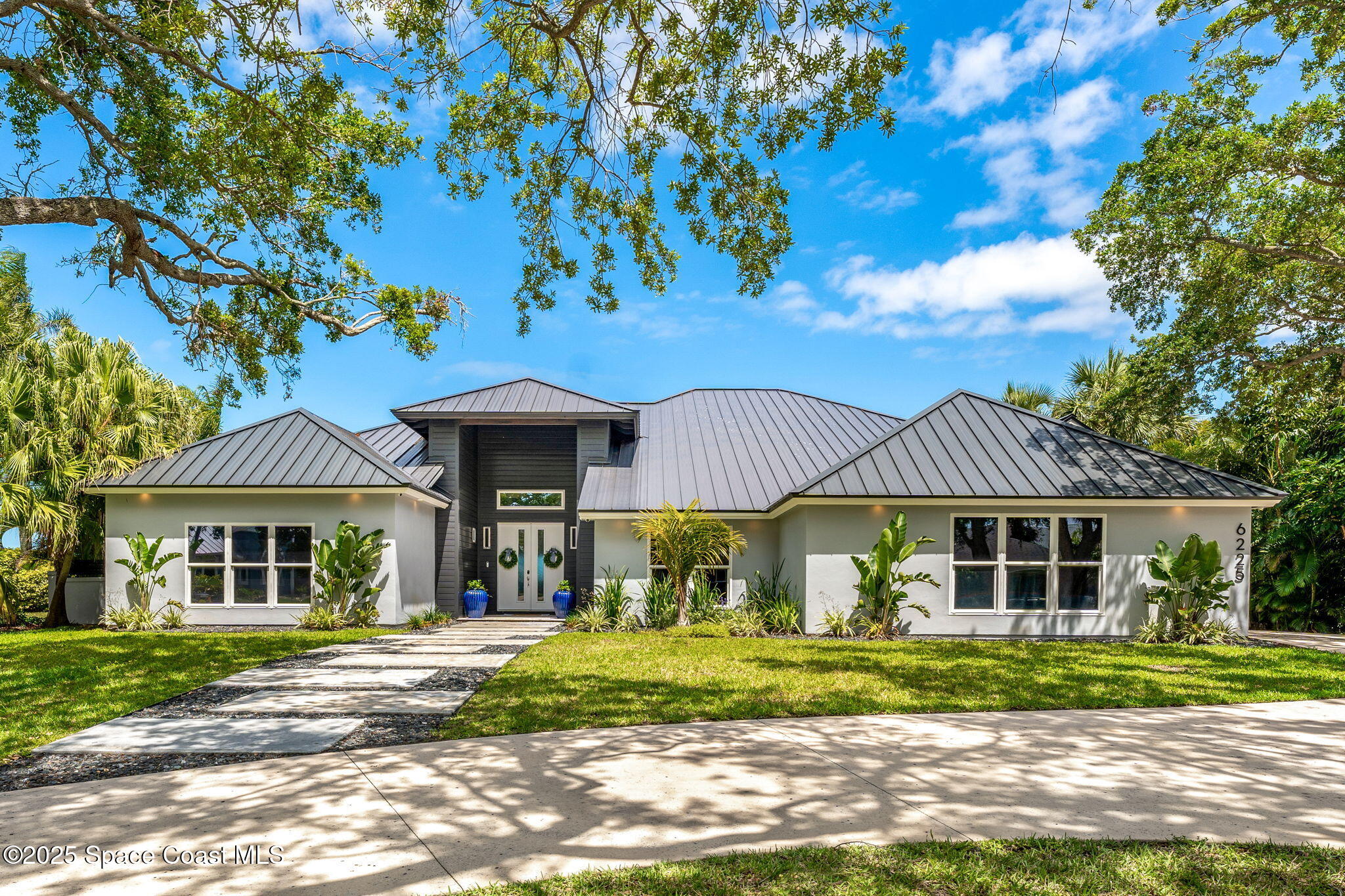 6225 Capstan Court Rockledge, FL 32955 - Photo 69 of 73 a front view of a house with a garden