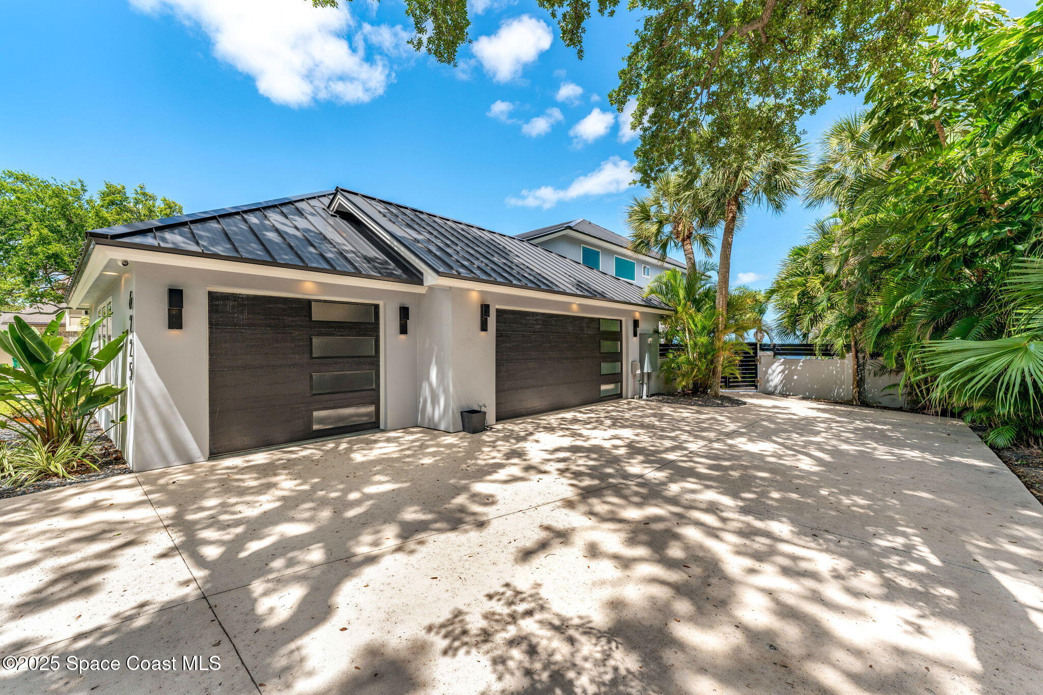 6225 Capstan Court Rockledge, FL 32955 - Photo 71 of 73 a front view of a house with a yard and garage