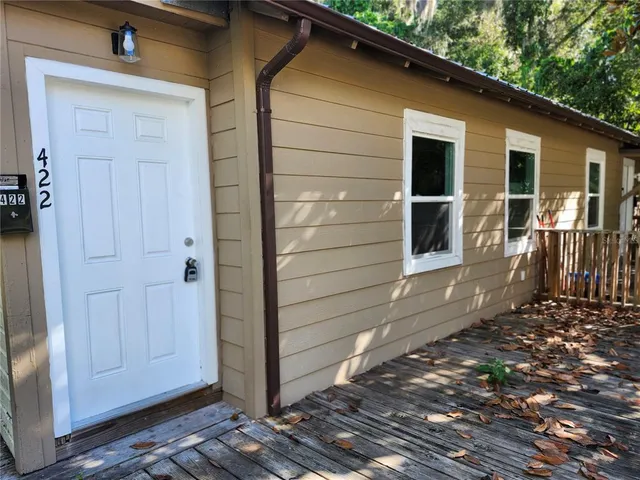a back view of a house with a door